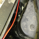 The power cable from the relay to the battery as well as the wiring to the foglight assemblies then run across in front of the battery. The battery power then snacks up to the battery terminal and the fog wiring runs down past this small air cleaner box and through a hole next to the headlight towards the bumper area. A modicum of zipties keps things relatively neat and tidy and from moving around too much.
